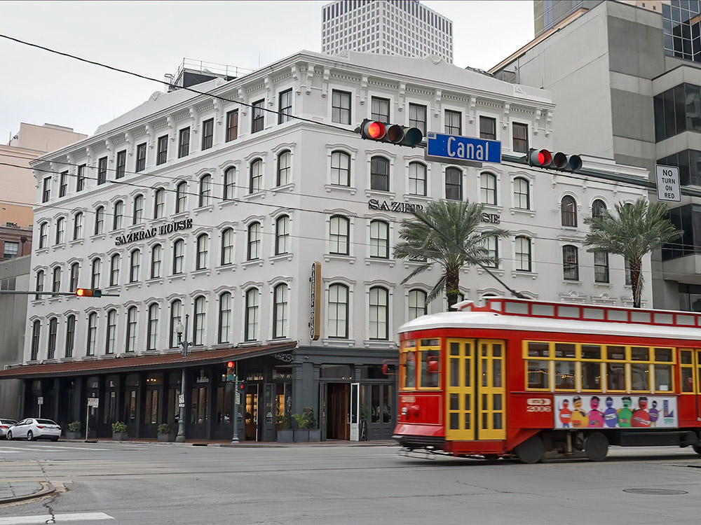 New orleans streetcar passes Sazerac Cocktail Museum on Canal Street