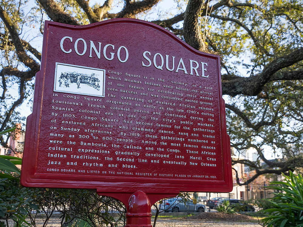 red historic marker tells the history of congo square in New Orleans