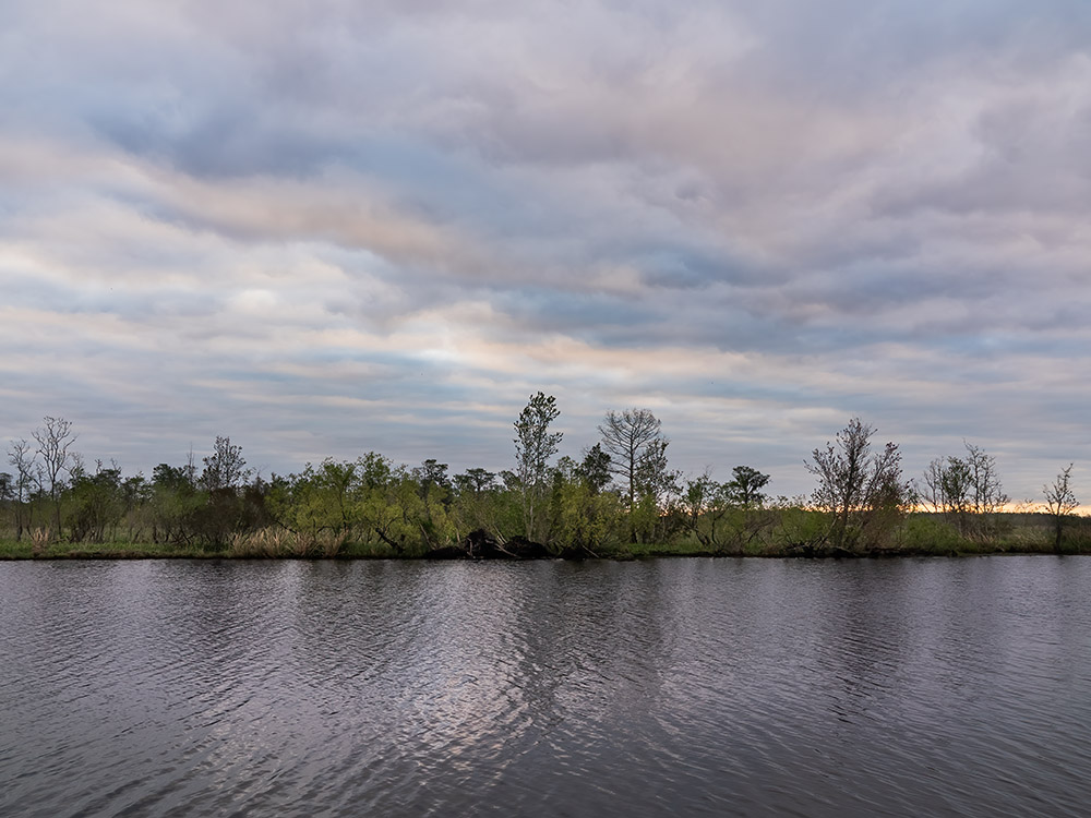 Daybreak clouds over water at Bayou Segnette State Park Louisiana