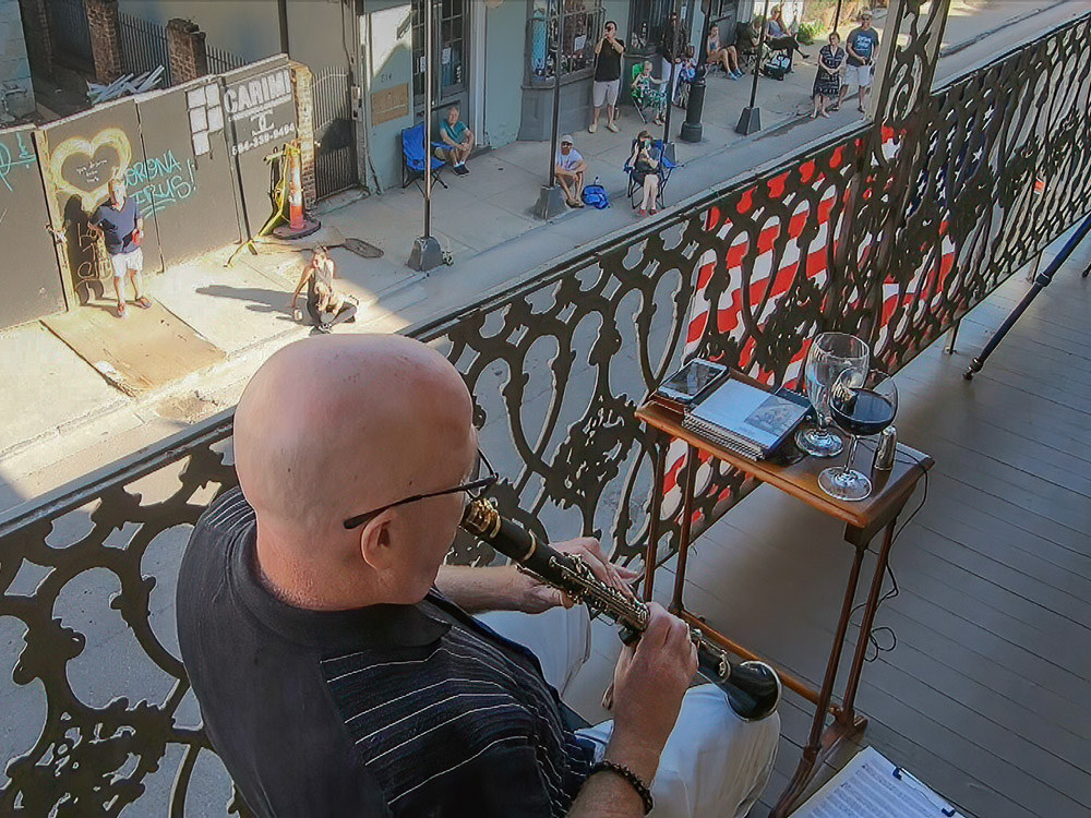 Tim Laughlin plays clarinet on french quarter balcony neighbors listen