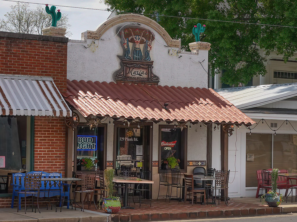sidewalk tables outside Maria's Mexican Restaurant in St. Joseph Louisiana