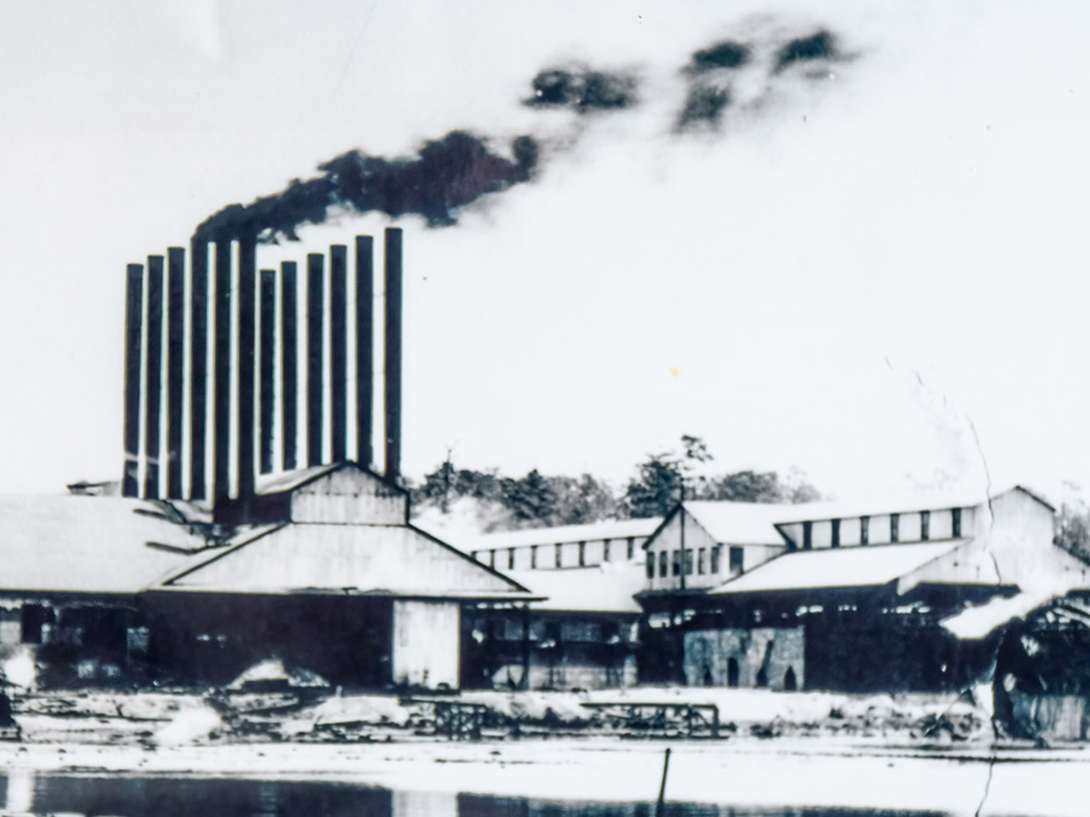 black and white photo of fullerton louisiana sawmill with smoke stacks