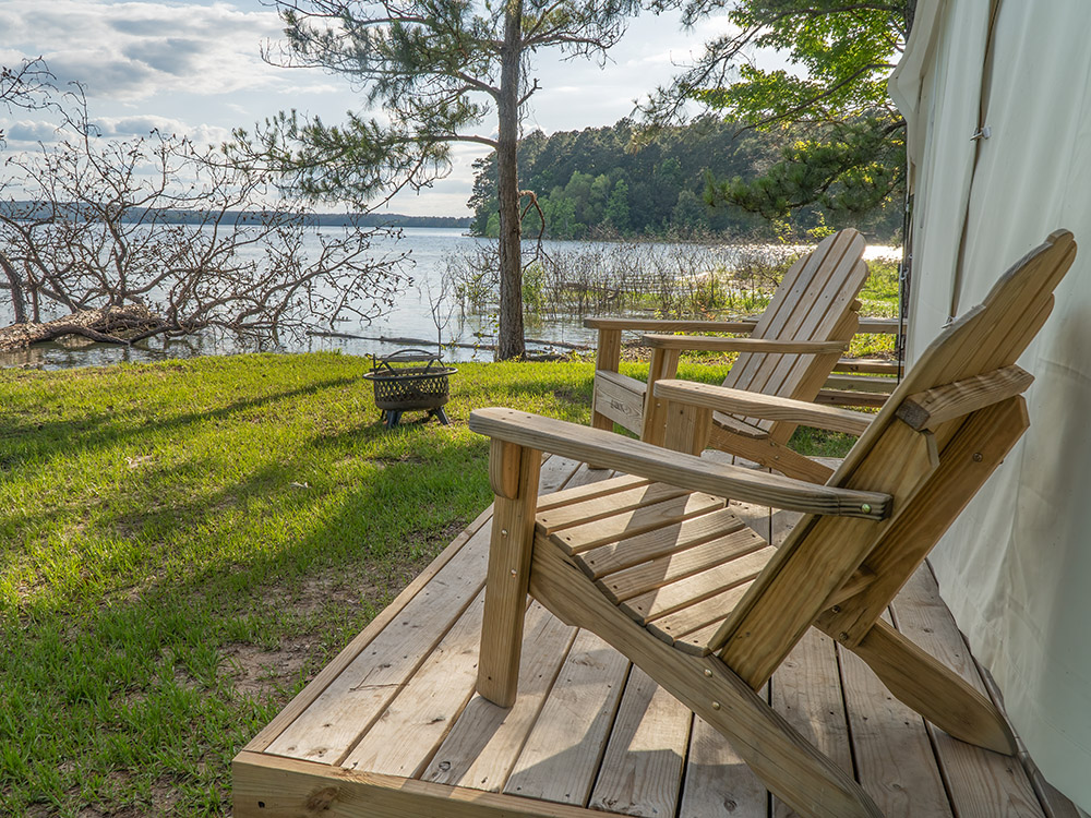 wooden chair on deck in front of tent overlooking Toledo Bend Reservoir Louisiana