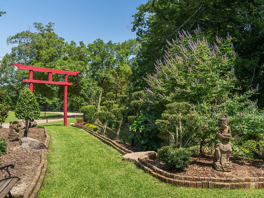 red Torii gate and flowering garden in Saint Francisville Louisiana