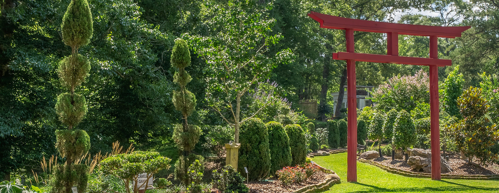 Red Japanese torri gate in garden in St. Francisville Louisiana