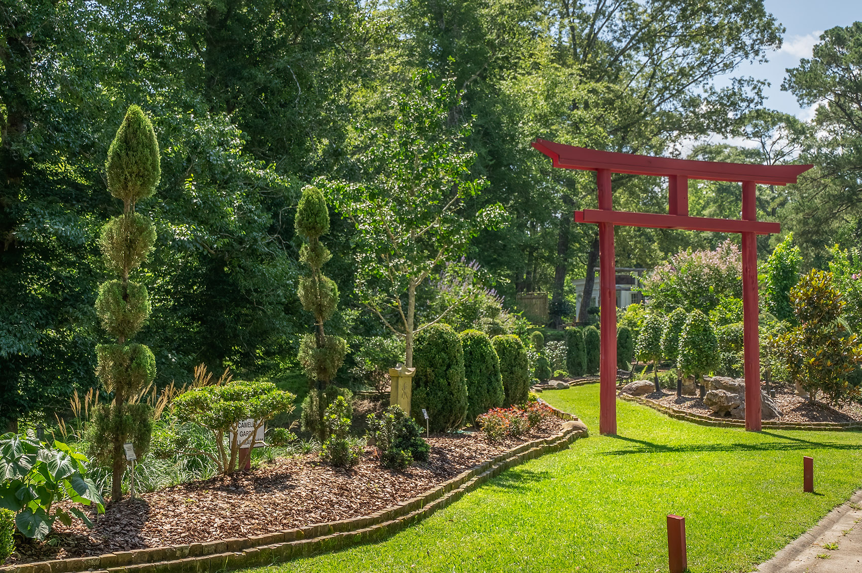 Red Japanese torri gate in garden in St. Francisville Louisiana
