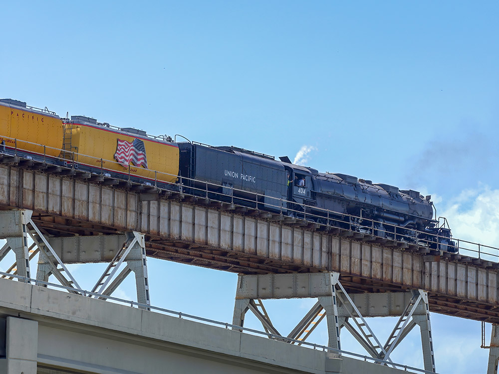 steam locomotive on railroad bridge