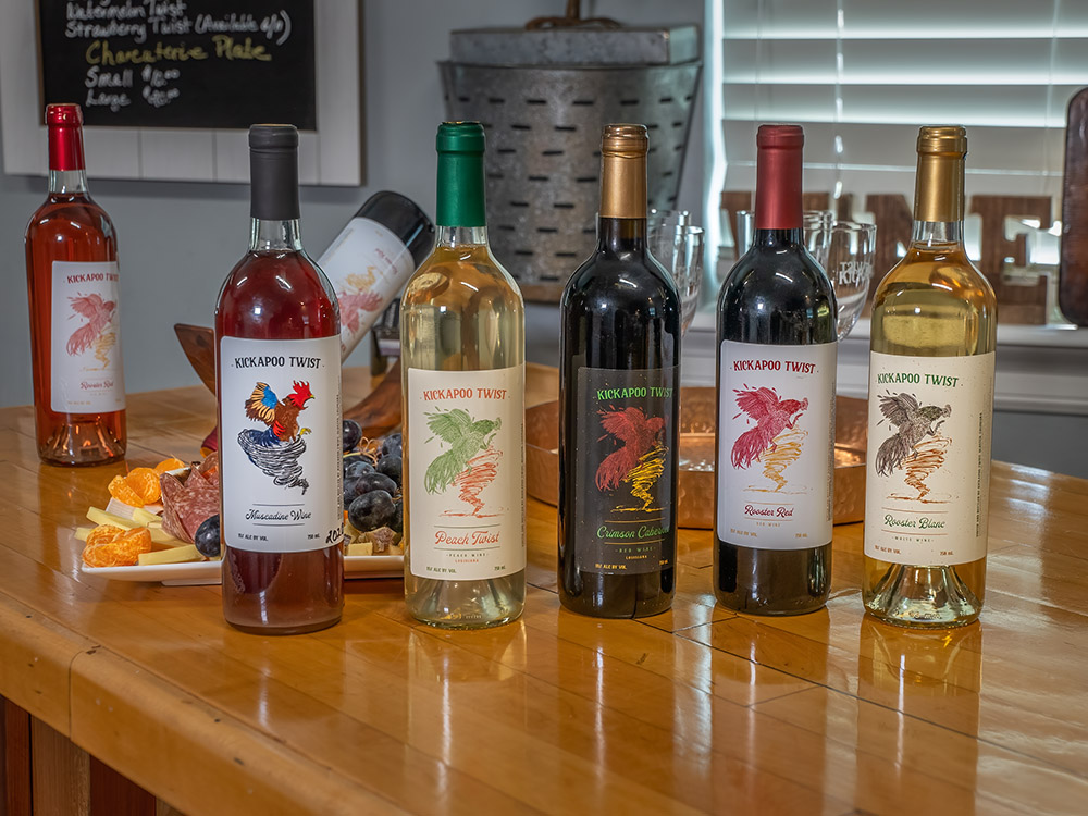 bottles of various Kickapoo Twist wines on counter