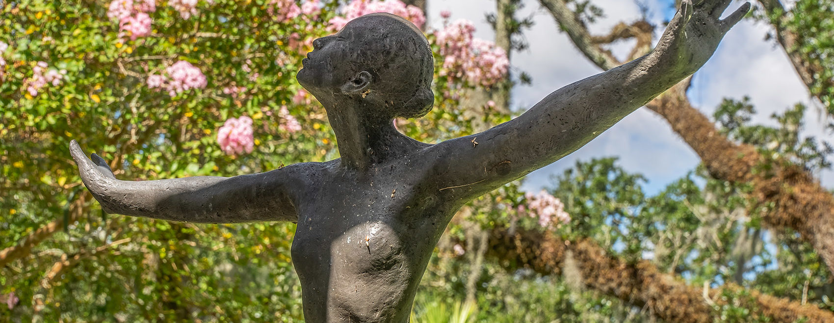 bronze statue woman outstretched arms enrique alferez