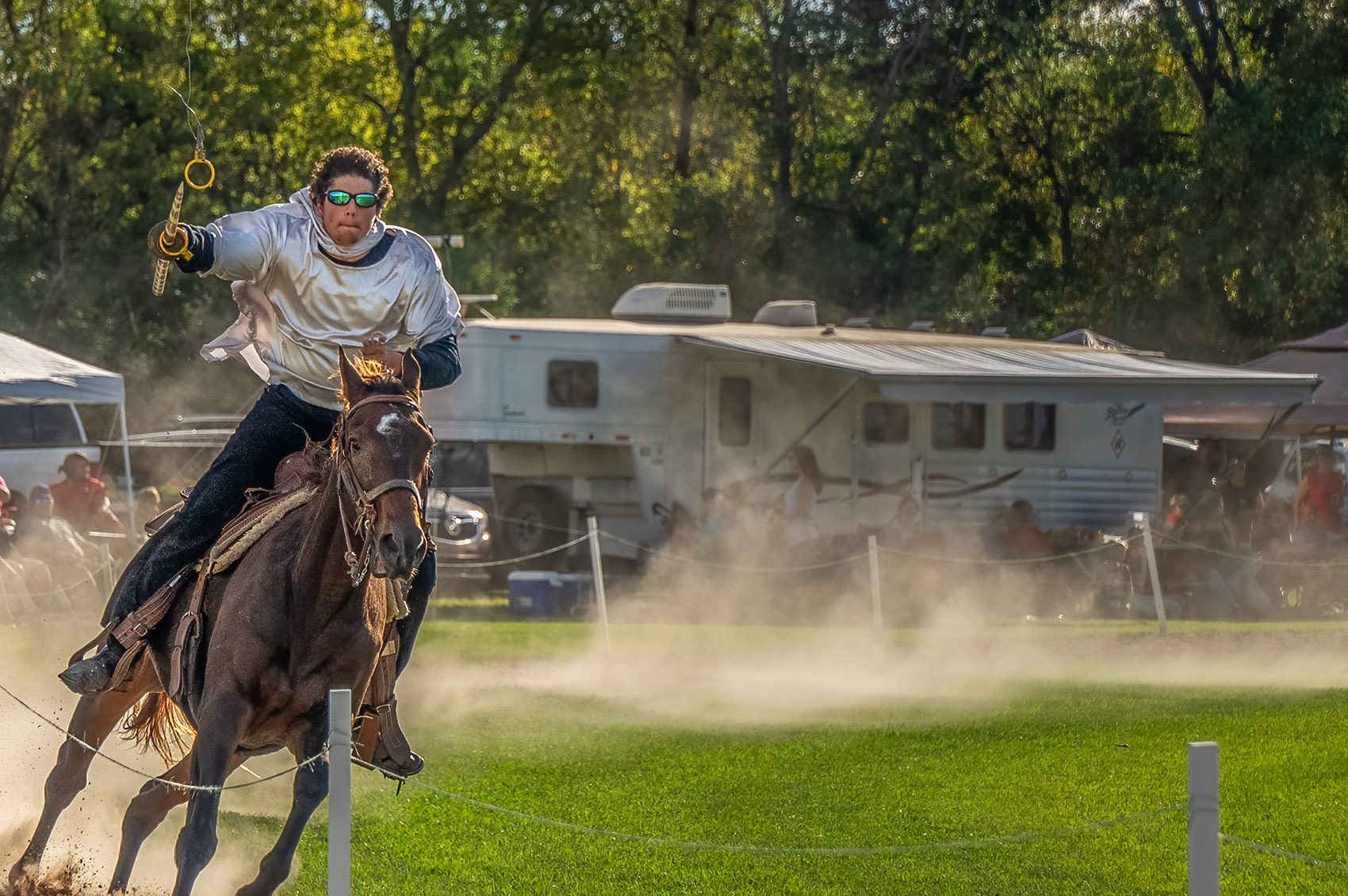 costumed rider on horseback with lance at le tournoi