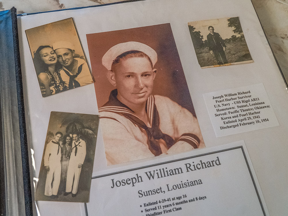 young man in navy uniform and other pictures in scrap book
