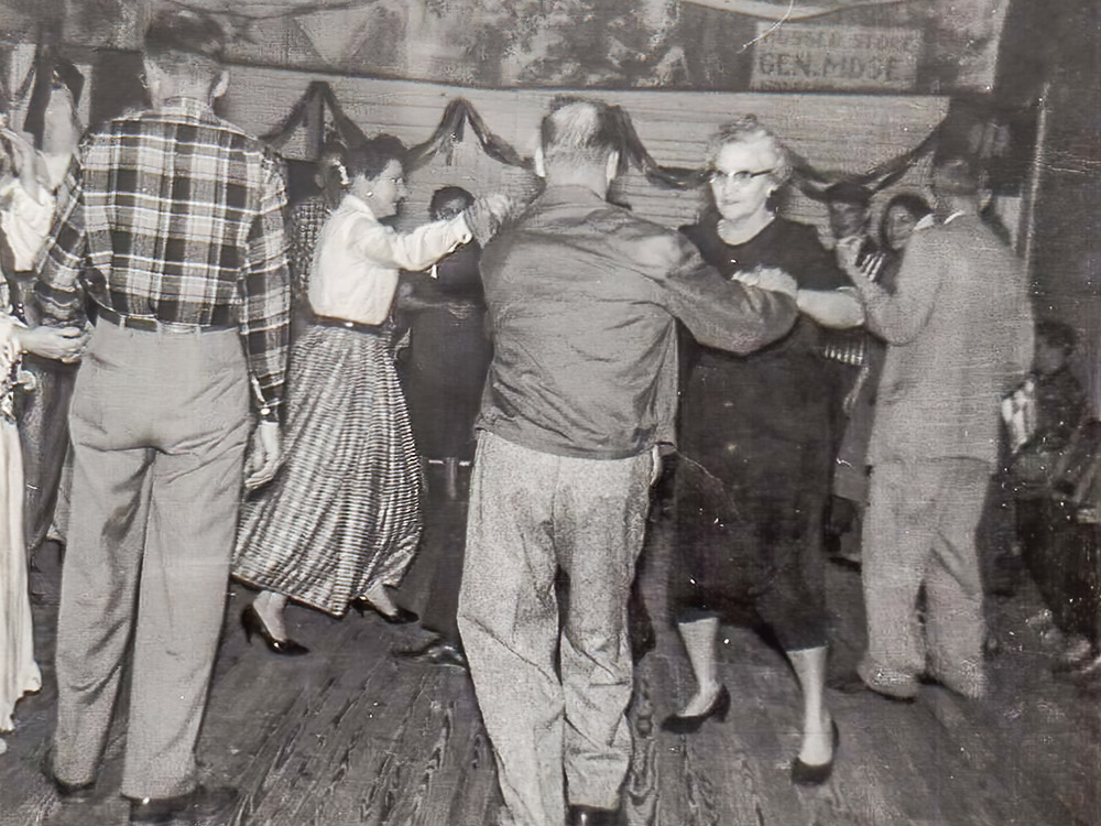black and white photo of adults dancing