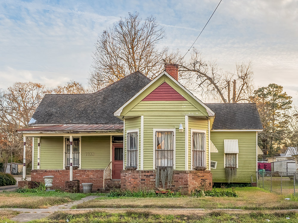 green colored wooden viictorian house is Louisiana Creole museum