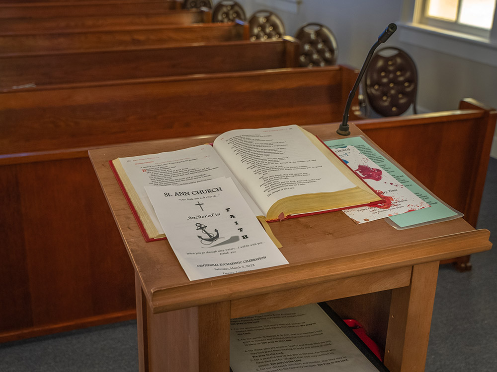 bible and program on lectern inside church