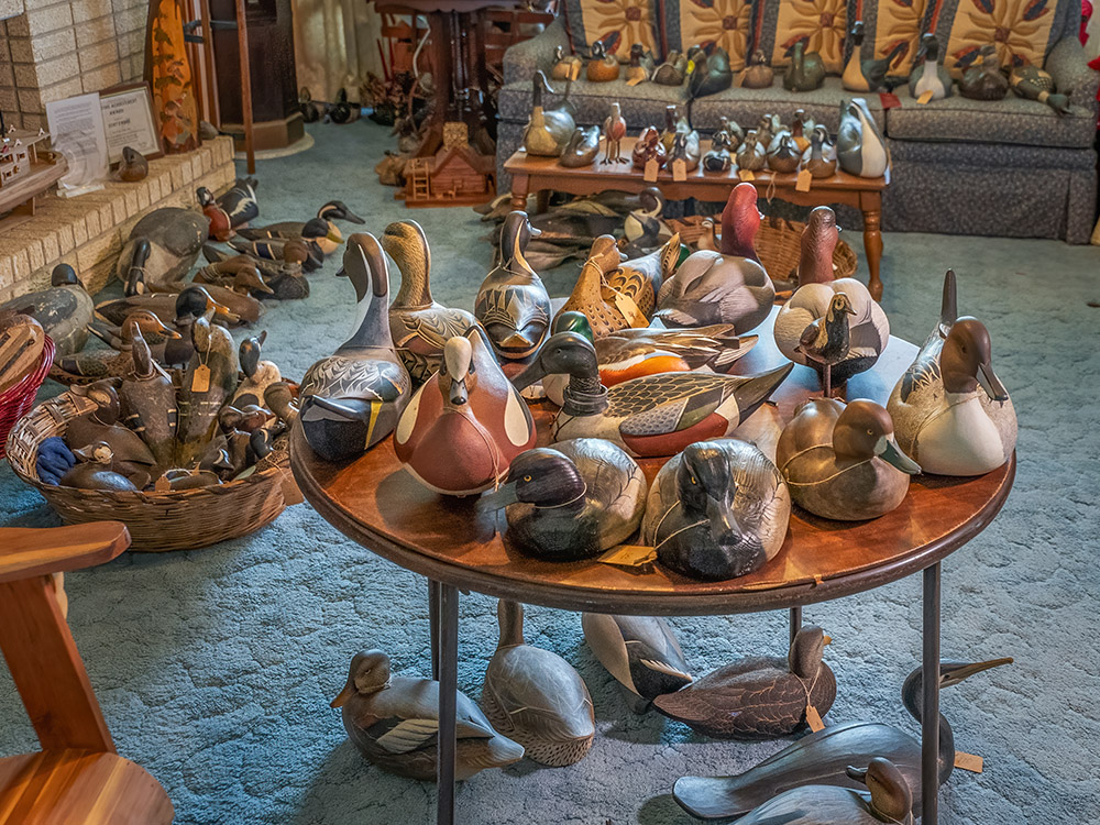 wood carved decoys on display in living room