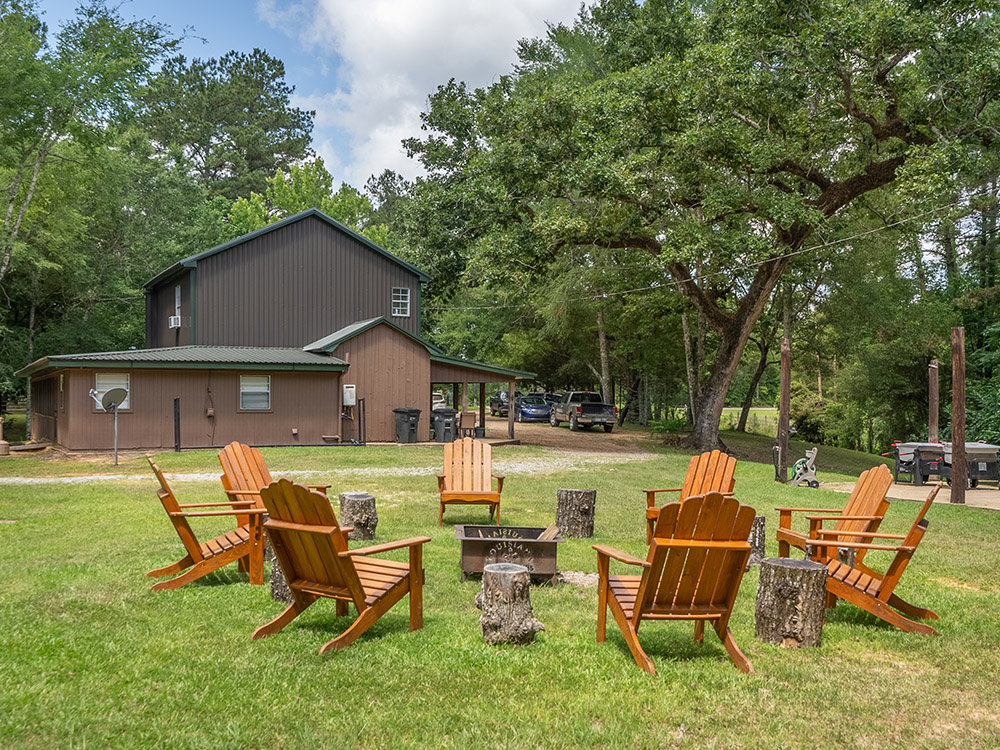 chairs on lawn outside brown colored lodge