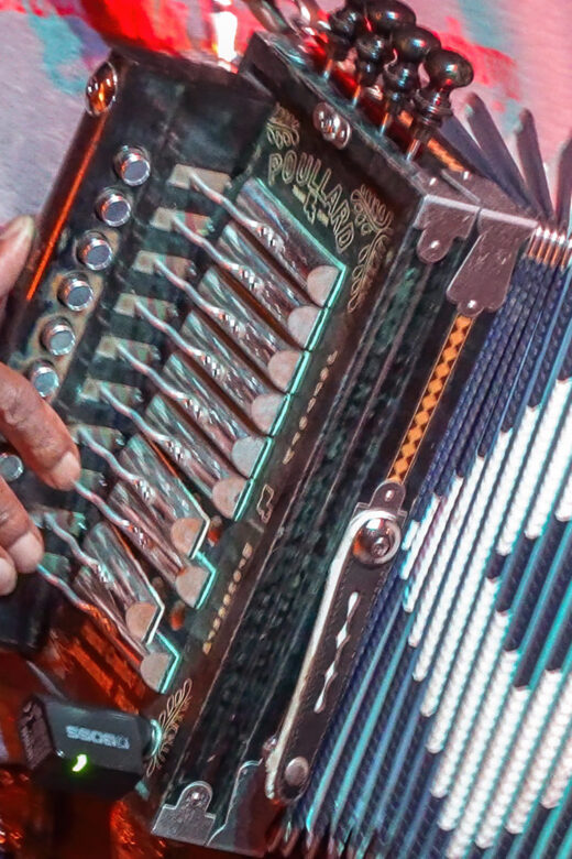 hand on keyboard playing cajun accordion