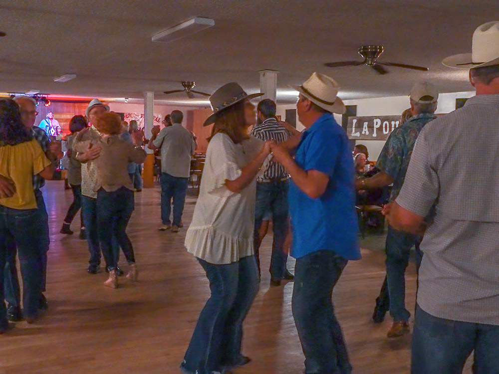 people dancing to Cajun music at La Poussiere dance hall
