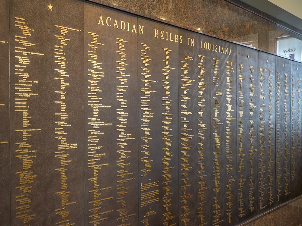 large wall sized plaque of names at Acadian Memorial