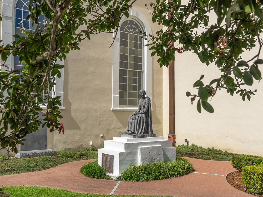 statue of Evangeline on the side of a church