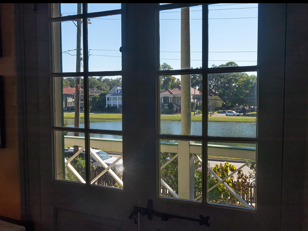 view through window to bayou and homes outside