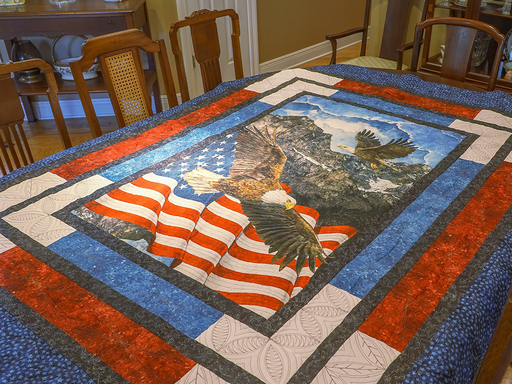 red white and blue quilt with american flag and eagle