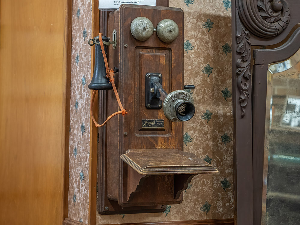 antique wall telephone on display in museum