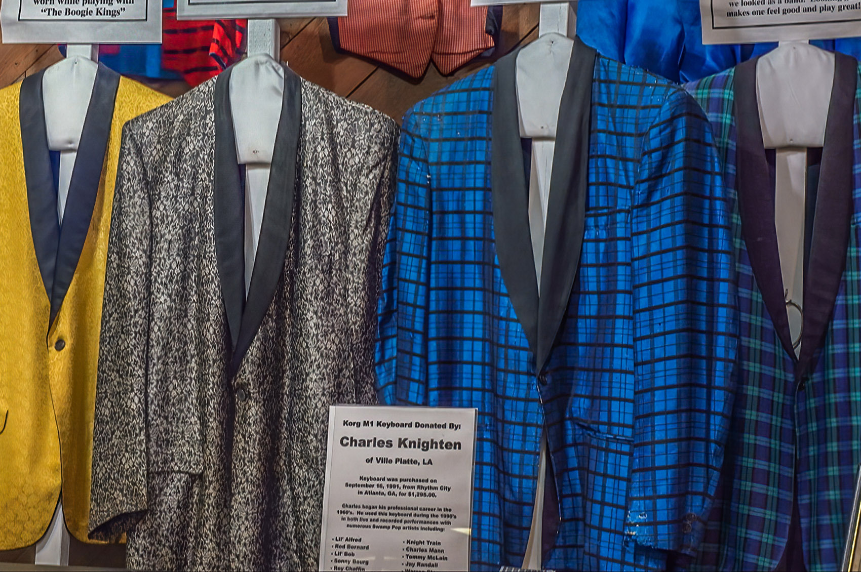 gold silver and blue plaid tuxedo jackets of swamp pop band members