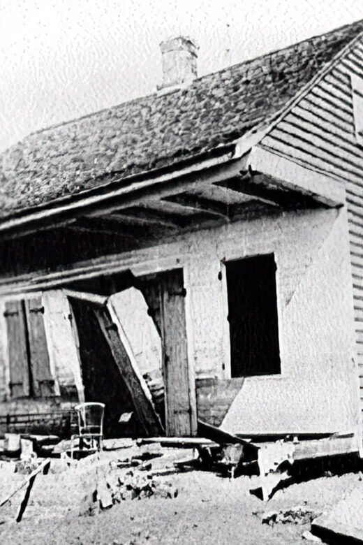 old wooden house with hurricane damage in black and white
