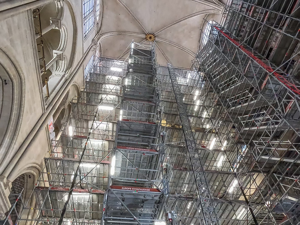 view looking up at scaffolding and high ceiling inside Notre Dame