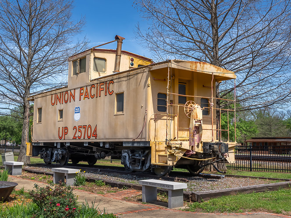yellow caboose from Union Pacific in outdoor display