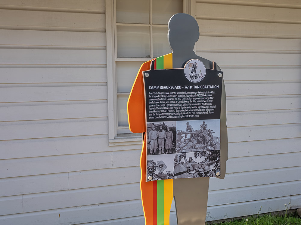 civil rights marker to 761st Tank Battalion in front of white wooden military building