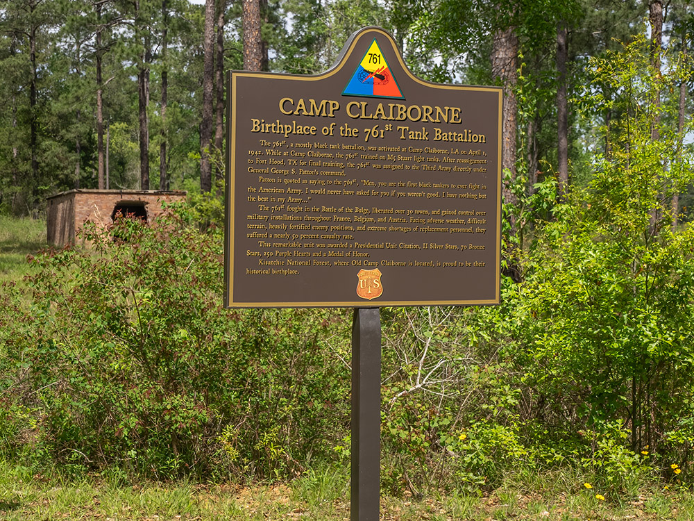 brown metal historical marker at Camp Claiborne to the 761st Tank Battalion