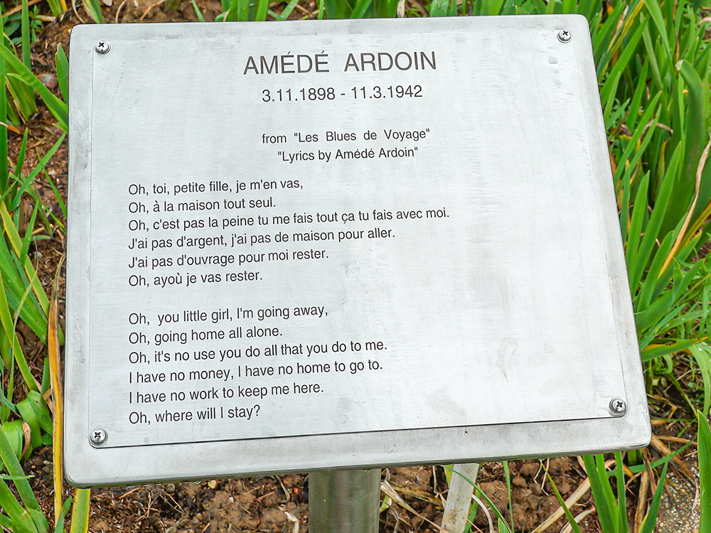 song lyrics of Amede Ardoin on a metal plaque
