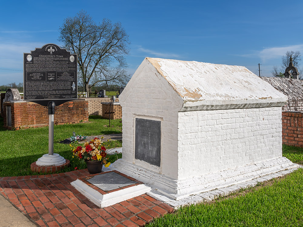 white brick tomb with historical market under blue sky