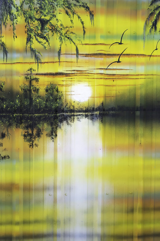 colorful painted mural of setting sun in the swamp