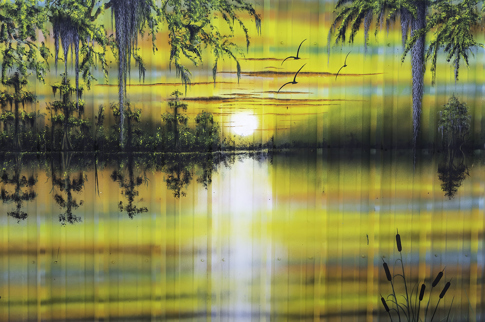 colorful painted mural of setting sun in the swamp