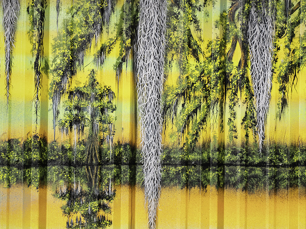 painting of moss and cyhpress trees reflected in water.