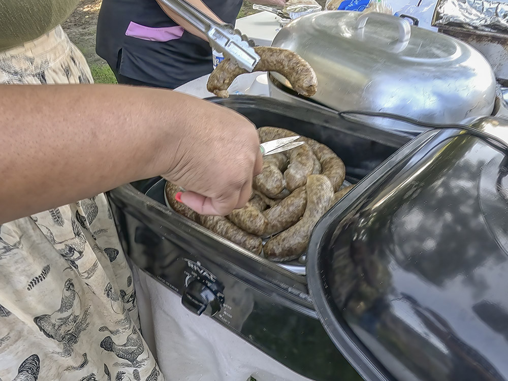 sausage being served from cooker