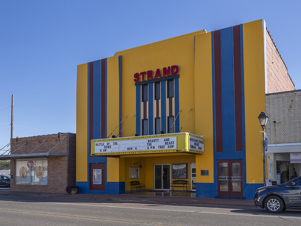 yellow and blue movie theater names Strand