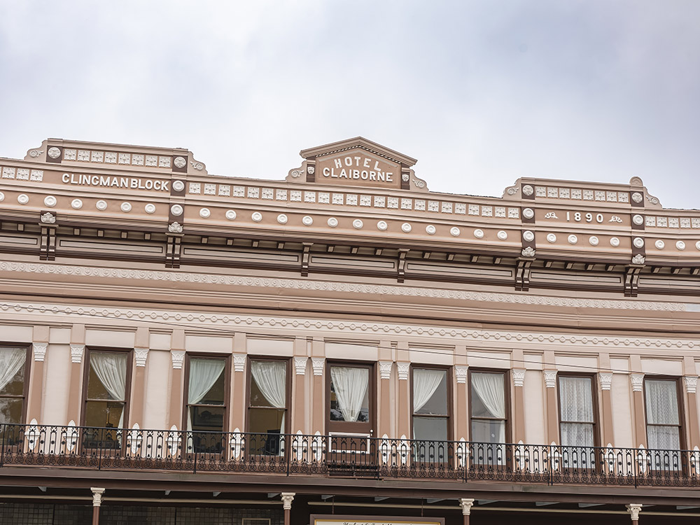 tan facade of 1890 hotel building in Homer.