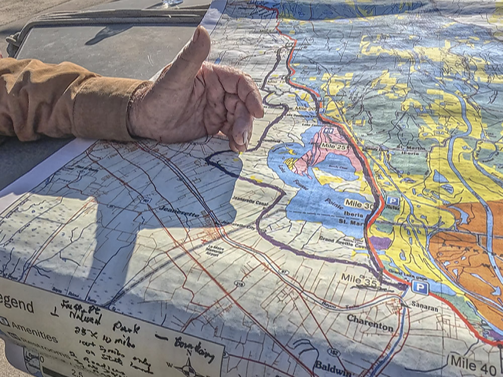 man's hand over map with proposed park boundary marked in black