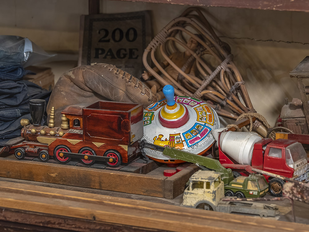collection of antique toys on store shelf.