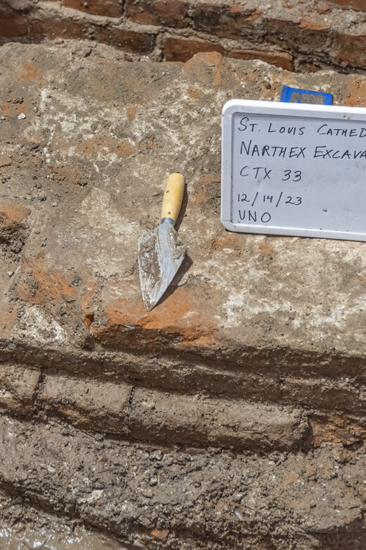 archaeology excavation trowel sign bricks cathedral