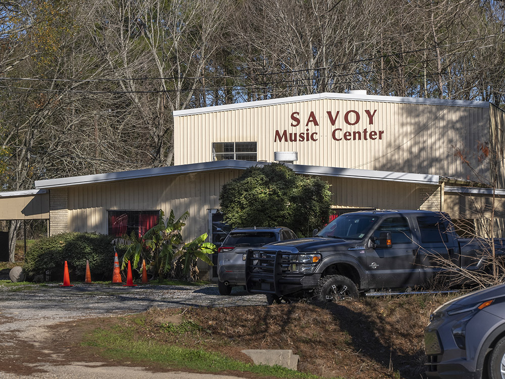 savoy music center metal building with vehicles parked in front