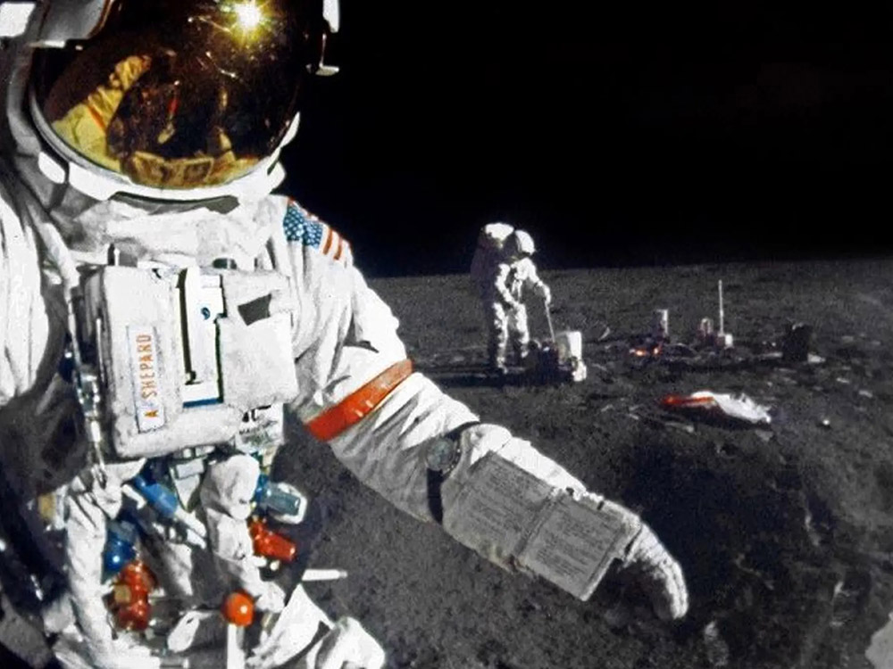 U.S astronauts walking on surface of moon