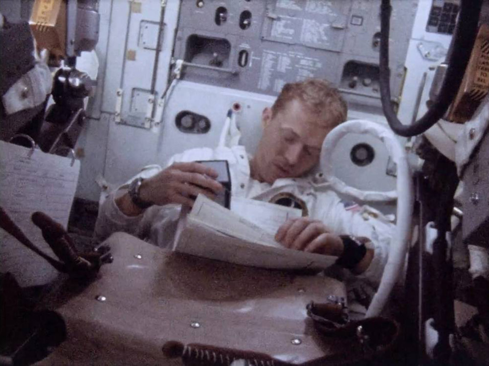 astronaut inside apollo command module