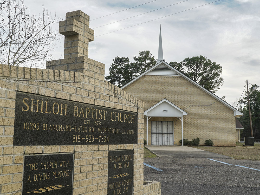 brick sign for shiloh baptist church in front of brick church