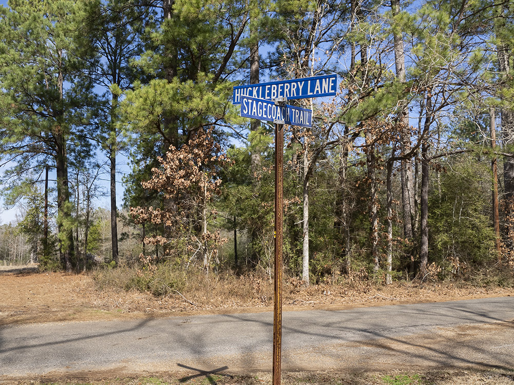 stagecoach trail street sign along blacktop road