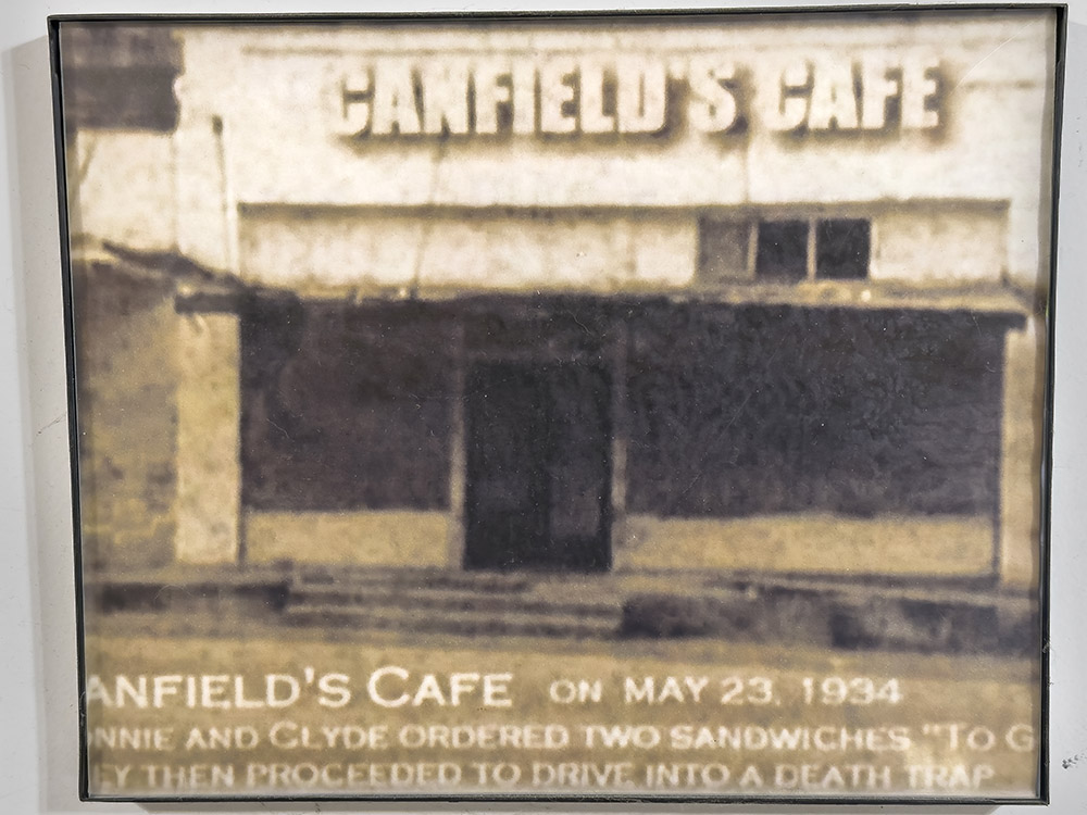 old photograph of building with sign canfield's cafe